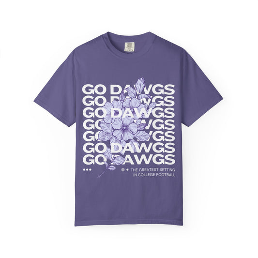 Purple t-shirt with floral design and text on a white background