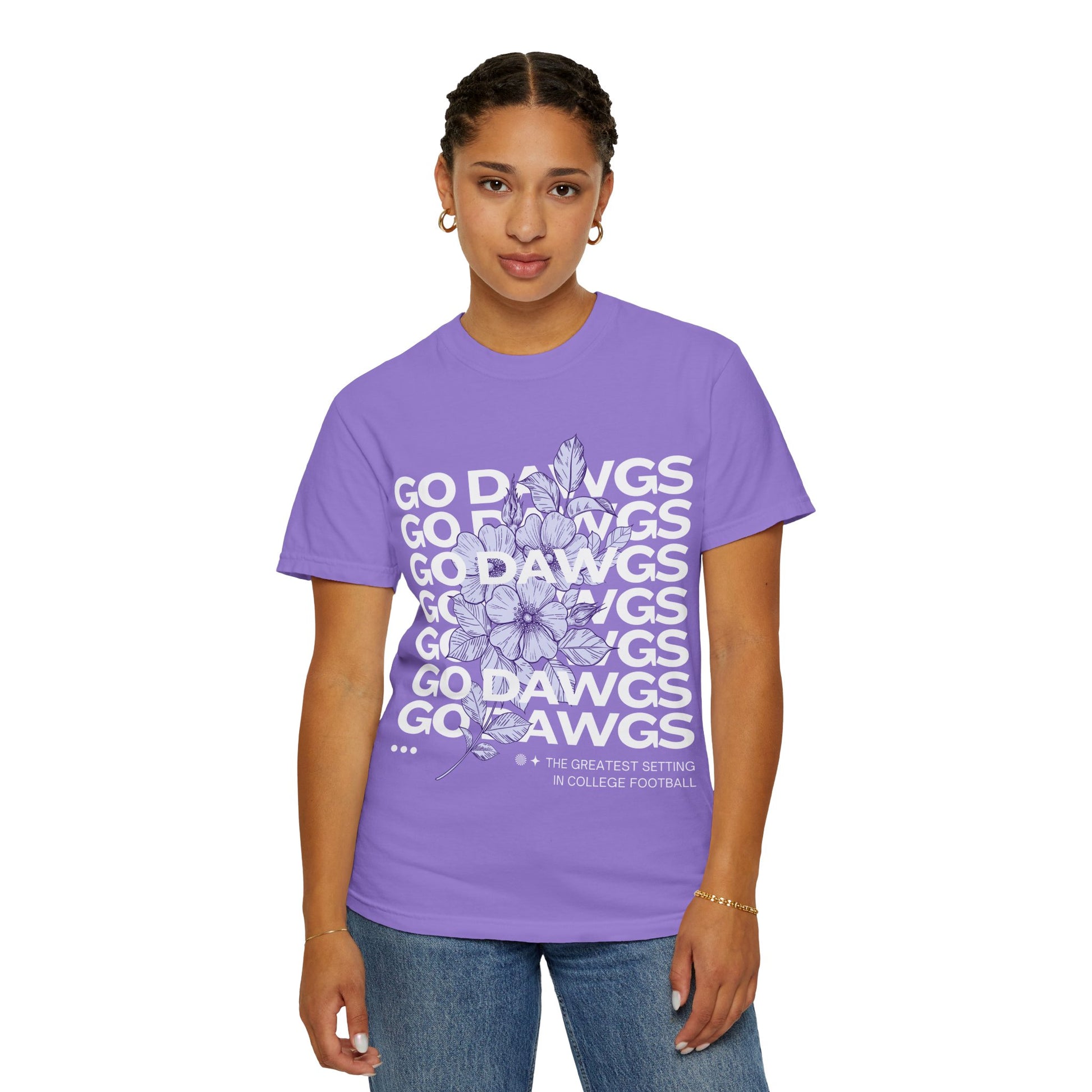 Person wearing a purple t-shirt with white text and floral design on a white background