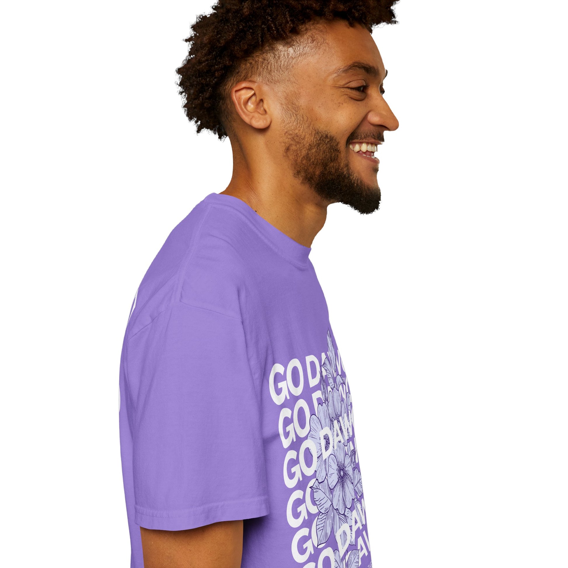 Man wearing a purple t-shirt with text on a white background